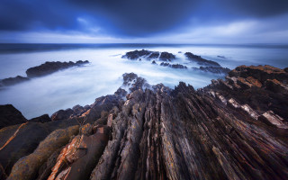 Rocky shore water mountains sky - a rocky shore free wallpaper for desktop