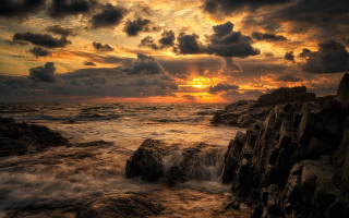 Sunset ocean rocks crashing shore - rock and water free wallpaper for desktop