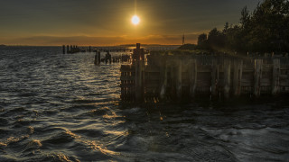 Sunset dock hudson river matte - a sunset over a body of water free wallpaper