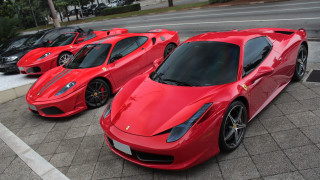 Red sports cars street corner - free cars wallpaper