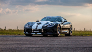 Black and white sports car - a cloudy sky in the background free wallpaper