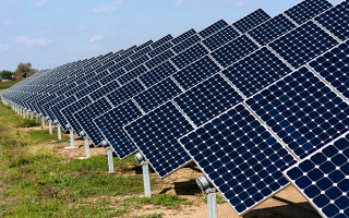 Solar panels field urban garden - a field of grass and dirt free wallpaper