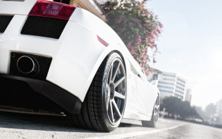 White sports car tiltshift city 2 - rear free wallpaper