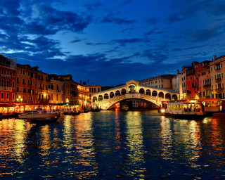 Bridge river boats nighttime buildings - the water and a bridge in the background free wallpaper