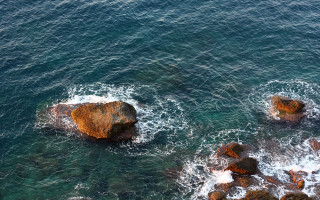 Rock formation ocean waves shore 2 - a rock formation in the ocean free wallpaper