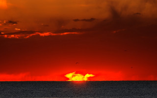 Orange cloud sky ocean boat - the water below free wallpaper