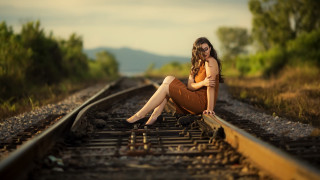 Woman sitting train track bokeh - anka zhuravleva free wallpaper