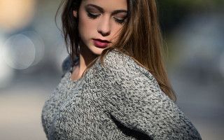 Woman longhair sweater lookingdown cellphone - a street free wallpaper