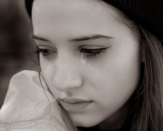 Sad woman crying cellphone tears - emotional free wallpaper for desktop