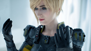 Blonde haired heroine cosplay cellphone - holding free wallpaper