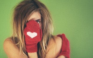 Woman heart mitt covering face - her mouth free wallpaper