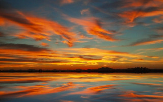 Sunset clouds reflecting water boat - colorful cloud free wallpaper