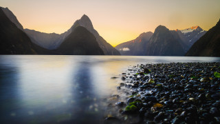 Sunset mountains lake rocks clouds - free sunset wallpaper
