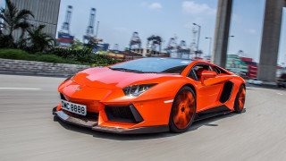 Bright orange sports car city 2 - vibrant free wallpaper