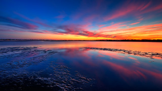 Sunset water clouds waves cityscape - a sunset over a body of water free wallpaper for desktop