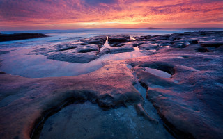 Sunset rocky beach ice water - the foreground and a body of water free wallpaper for desktop