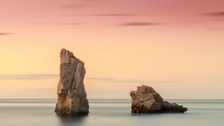 Large rock ocean formation sunset - a large rock free wallpaper