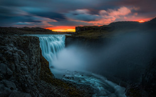 Waterfall sunset clouds mountain lake - a waterfall in the foreground free wallpaper