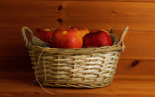 Basket apples wooden table wood - a basket of apples free wallpaper