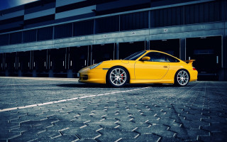 Yellow sports car brick road 3 - a brick road in front free wallpaper