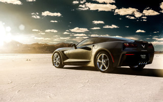 Black sports car desert sky - a desert area free wallpaper