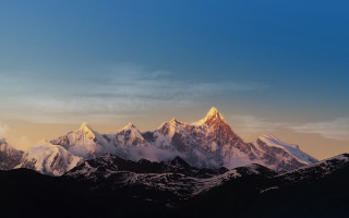 Mountain range clouds snow capped - a few snow free wallpaper