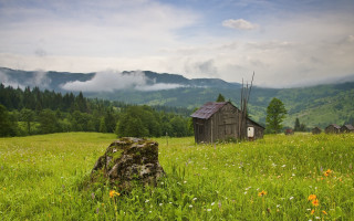 Small cabin mountains clouds flowers - a small cabin in a field free wallpaper