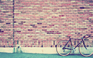 Bike parked brick wall street - a sidewalk in front free wallpaper