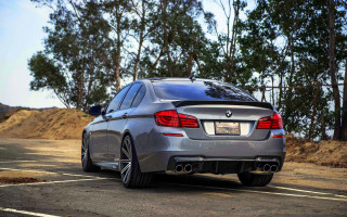 Silver car forest parking lot - side profile free wallpaper