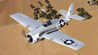 Small airplane flying over crops - a small airplane free wallpaper