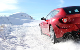 Red car snowy road mountain - viennese actionism free wallpaper