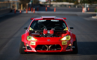 Red car hood up driving - a hood free wallpaper