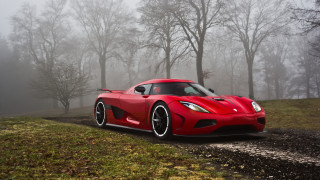 Red sports car foggy forest - free cars wallpaper