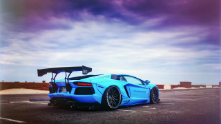 Blue sports car parking lot 10 - top of its free wallpaper