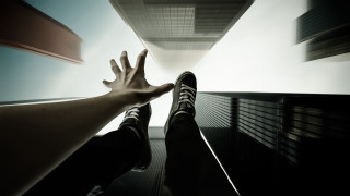 Hand reaching highrise sky feet - a persons foot free wallpaper