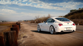 White car road hill clouds - a sky free wallpaper for desktop