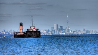 Boat cityscape cloudy water skyscraper - a boat floating free wallpaper