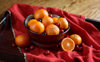 Bowl oranges cranberries red cloth - a red cloth free wallpaper