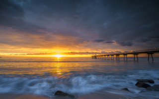 Pier sunset beach waves dusk - a pier free wallpaper for desktop