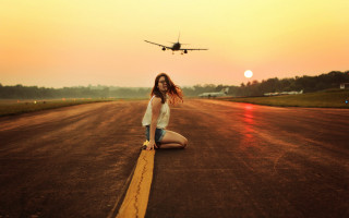 Woman kneeling plane sky beach - a plane in the background free wallpaper for desktop