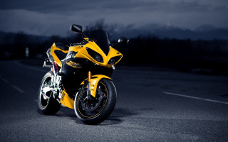 Yellow motorcycle night city lights - a yellow motorcycle free wallpaper