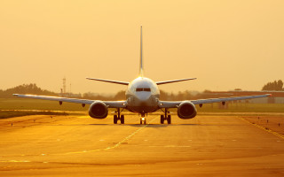 Large jetliner runway sunset backlit 2 - top of an airport runway free wallpaper