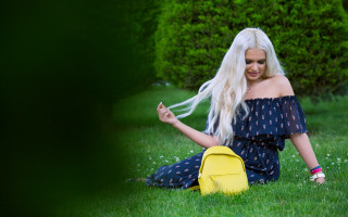 Blonde woman sitting grass yellow - summer vibrancy free wallpaper
