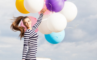 Woman balloons smiling beachball joyful - a woman holding free wallpaper