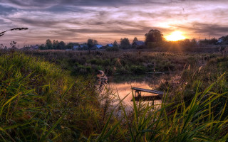 Marshy waterboat sunset tallgrass nature - a small boat free wallpaper