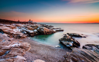 Rocky beach lighthouse sunset longexposure - a lighthouse in the distance free wallpaper