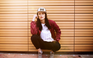 Woman ledge baseballcap redjacket blackpants - black pants free wallpaper for desktop