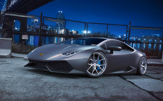 Silver sports car night city 5 - a city skyline in the background free wallpaper