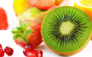 Kiwi strawberries oranges fruit closeup - fructose free wallpaper