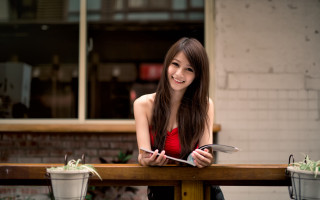 Woman table potted plant brick - a woman sitting free wallpaper